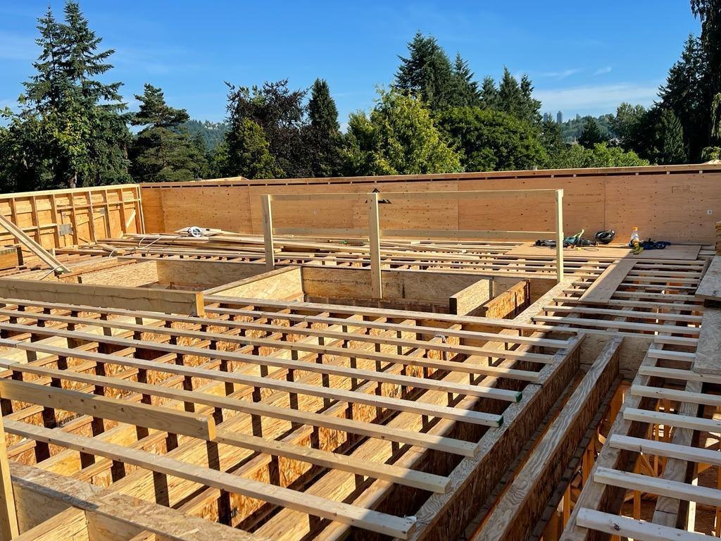 Wood floor joists laid out across a residential build